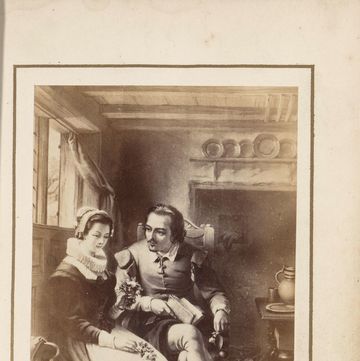 drawing of a woman and a man sitting inside near a window, she looks down, he looks at her