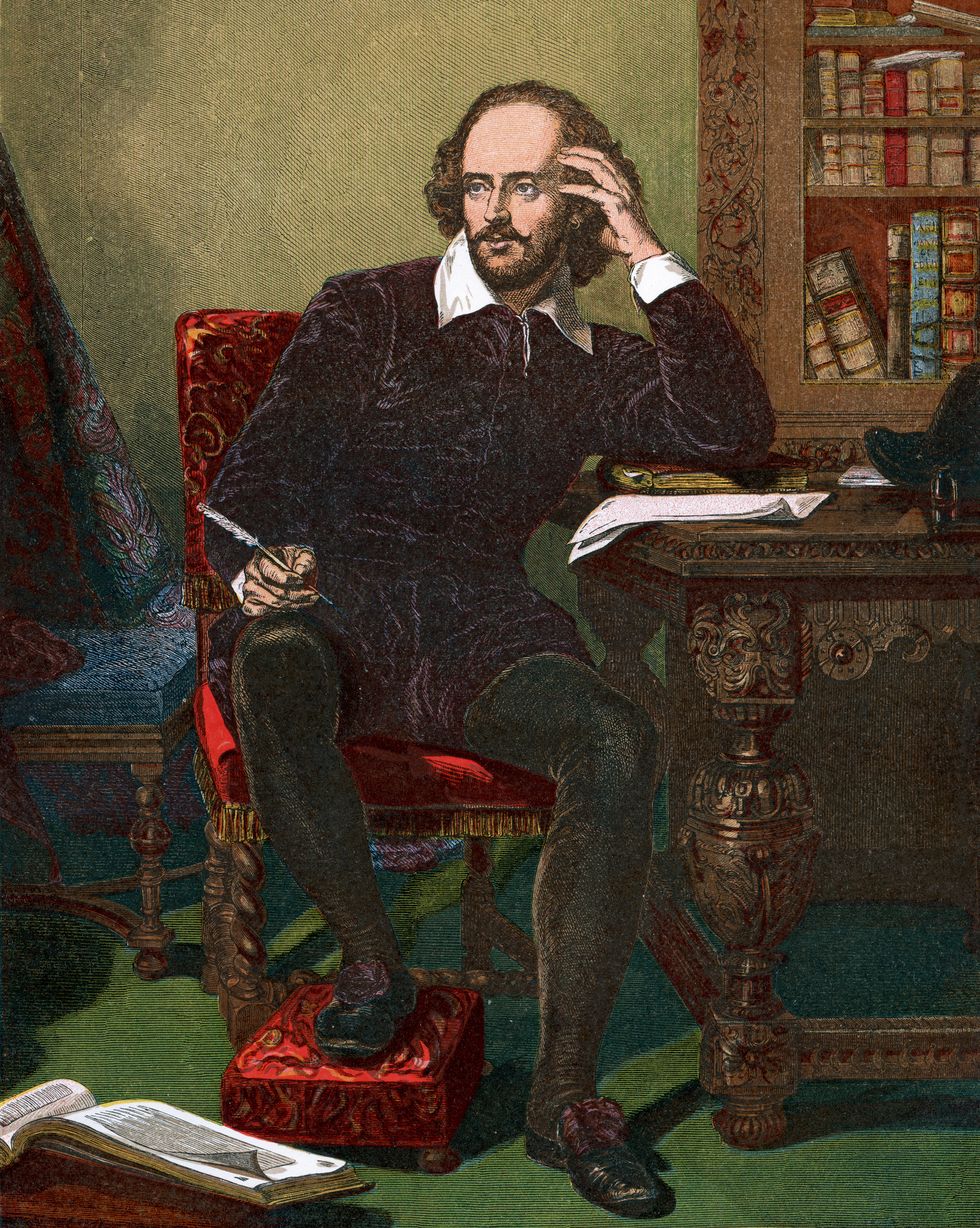 a color illustration of william shakespeare with the writer sitting in a cushioned red chair, his right hand holds a quill and rests on his right knee, his left elbow rests on an ornate wood desk with his left hand holding his head, he wears a dark outfit with a large white collar, dark tights, and dark shoes