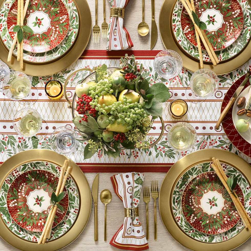 a festive dining table set with elegant tableware and decorations