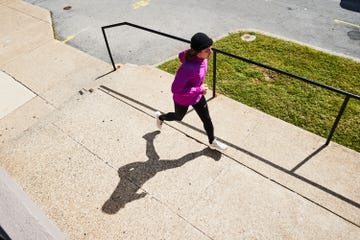 person running along a sidewalk