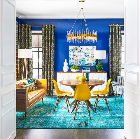 blue dining room with colorful curtains