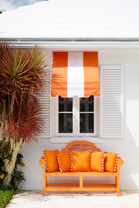 patio with orange awning and bench