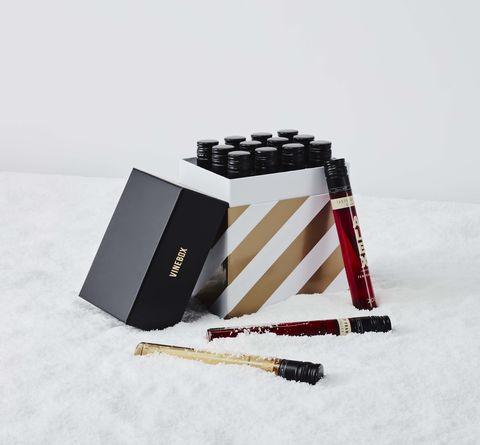 a striped box of wine vials on a white snowy background