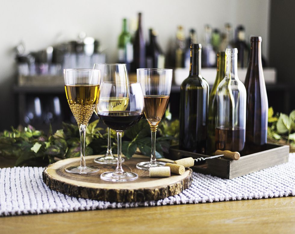 wine tasting theme with various bottles of wine and glasses