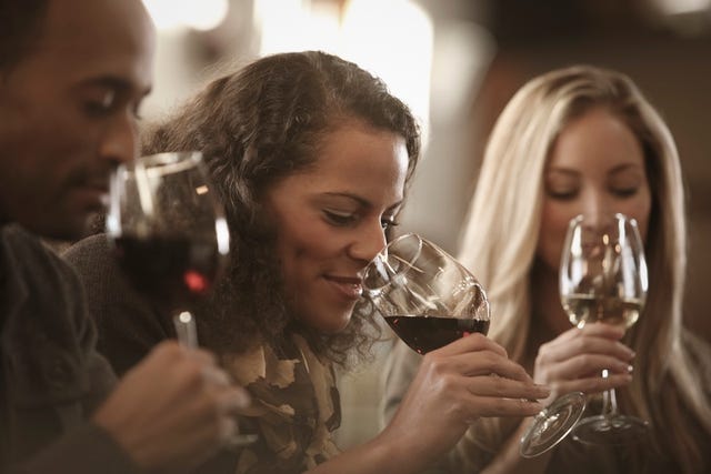 Friends tasting wine together
