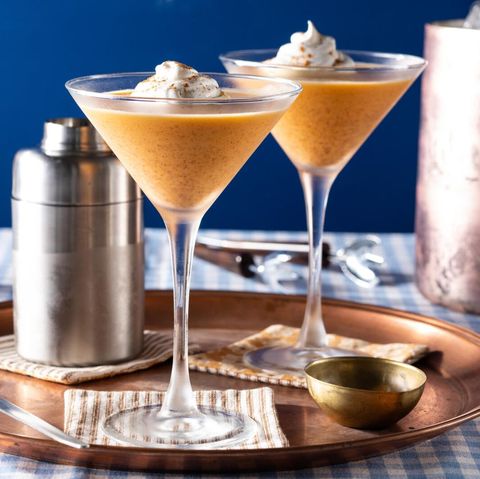 pumpkin pie martini with whipped cream on tray