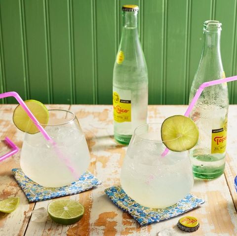ranch water cocktail with bottles of sparkling water