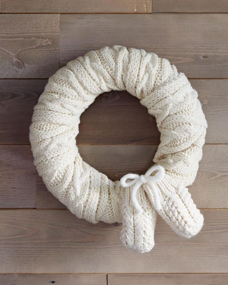 wreath wrapped with a scarf and mittens