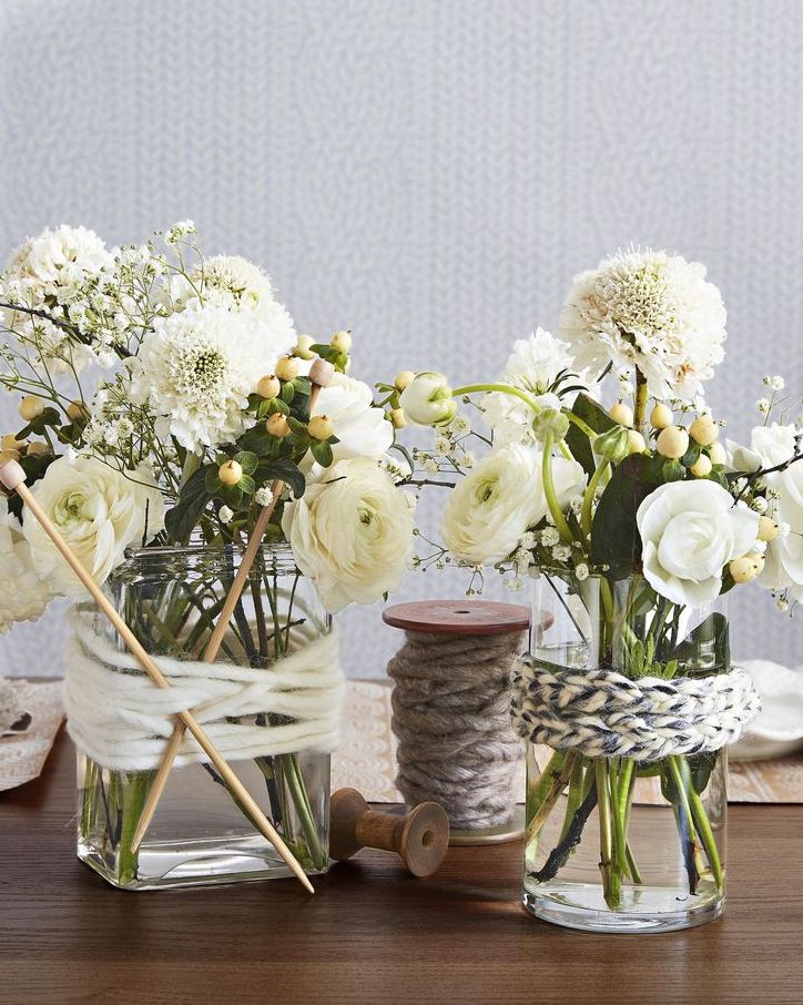 yarn wrapped vases with white flowers