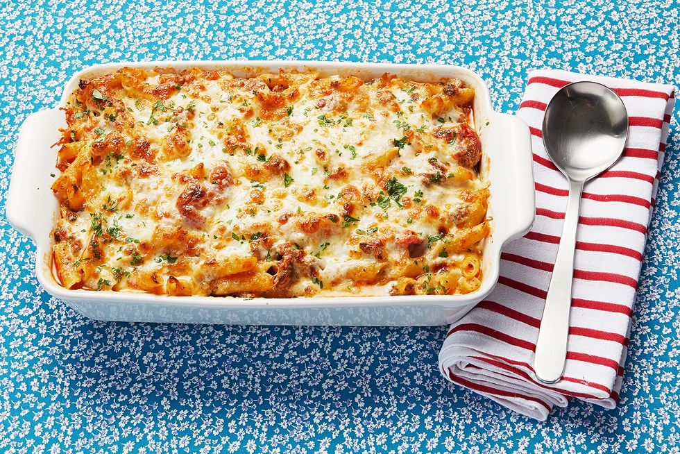 baked ziti on blue floral background with striped napkin