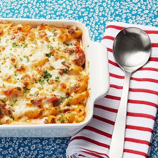 baked ziti on blue floral background with striped napkin