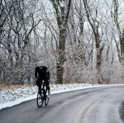 chris pino riding in the winter on a road, time spent outside in snow boosts body appreciation