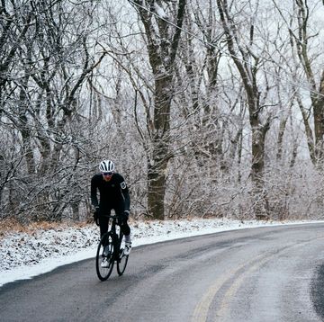chris pino riding in the winter on a road, time spent outside in snow boosts body appreciation