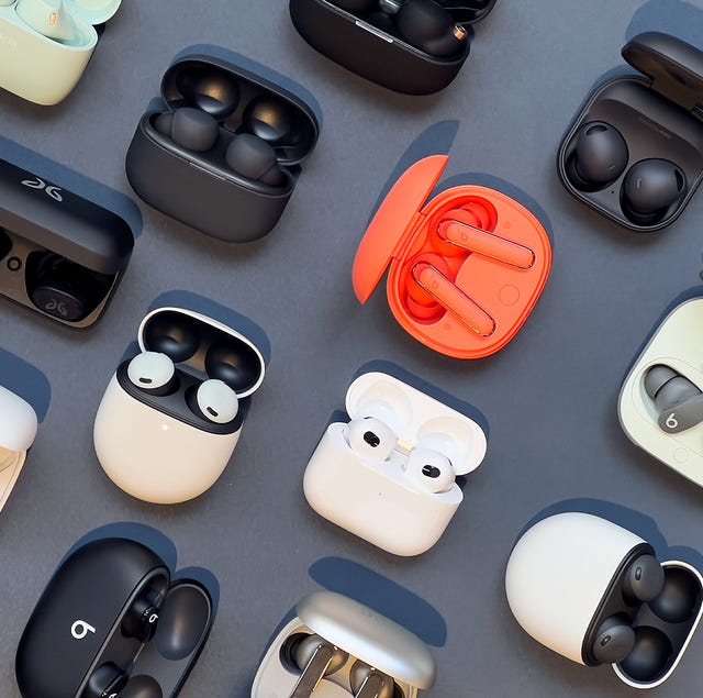 collection of wireless earbuds in charging cases