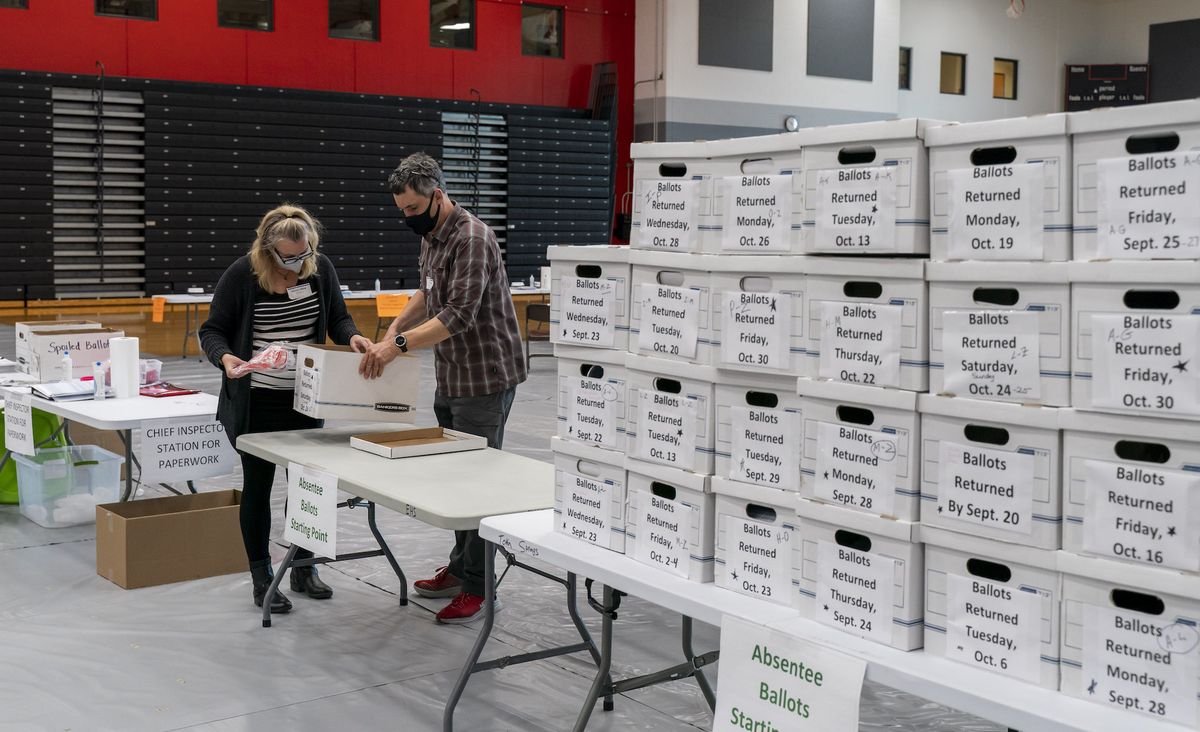 madison, wi   november 03 poll workers angela and zach achten check in a box of absentee ballots in the gym at sun prairie high school on november 3, 2020 in sun prairie, wisconsin the entire gym was dedicated to counting the absentee ballots after a record breaking early voting turnout, americans head to the polls on the last day to cast their vote for incumbent us president donald trump or democratic nominee joe biden in the 2020 presidential election  photo by andy manisgetty images