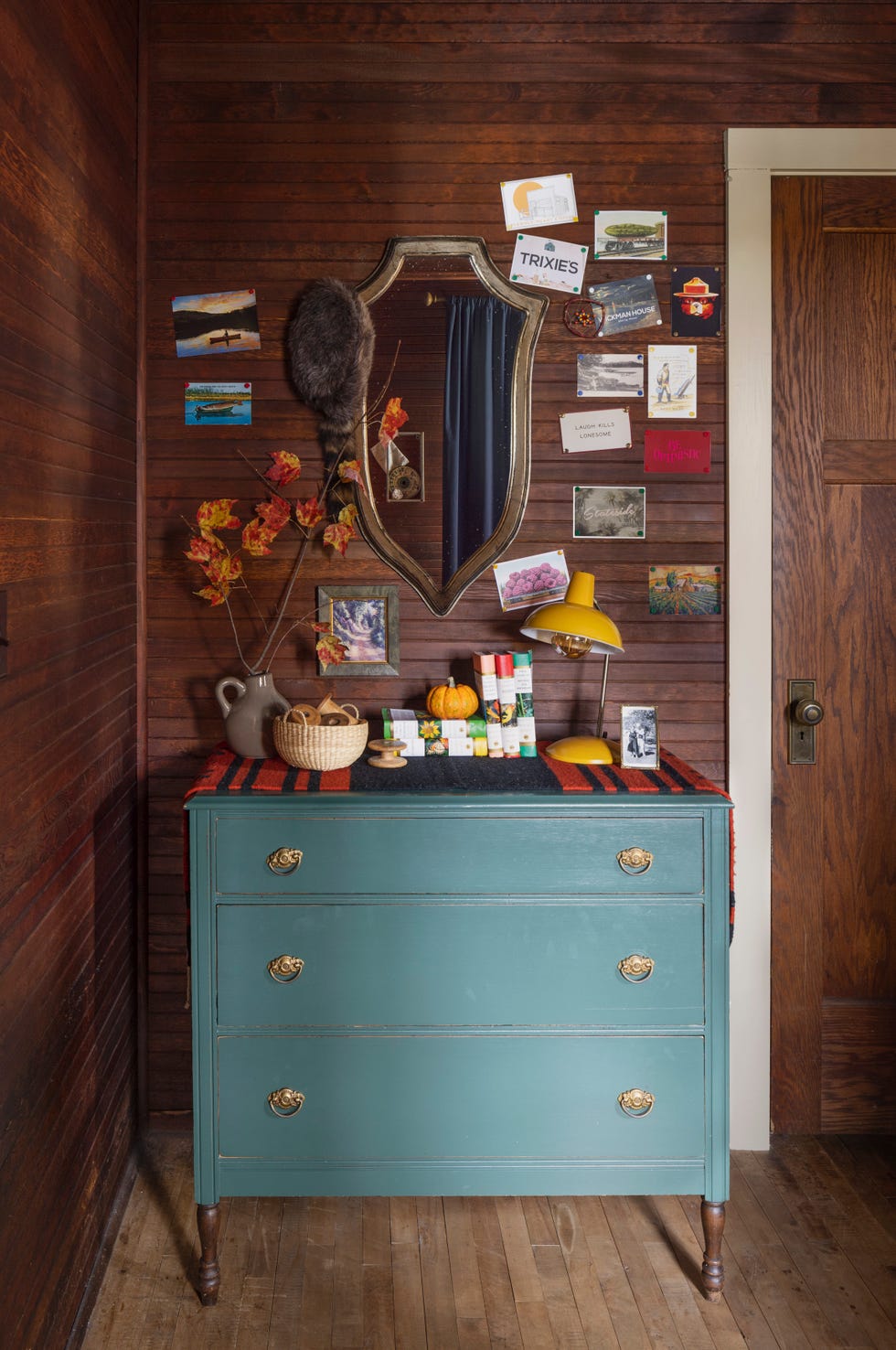 rustic cabin guest bedroom with blue dresser