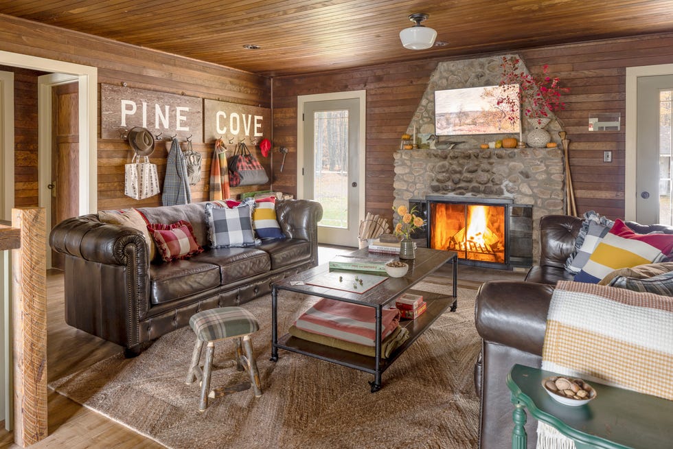 wisconsin northwoods cabin living room with stone fireplace