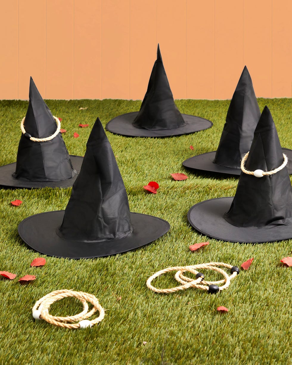 witch hats scattered on grass with ring toss circles for playing witch hats scattered on grass with ring toss circles for playing