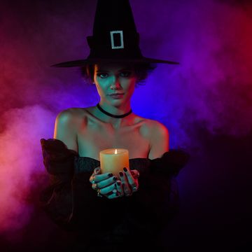 witch holding candle