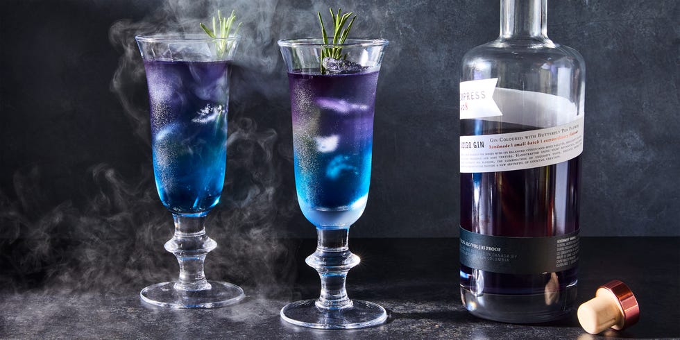 purple and blue layered drink with rosemary