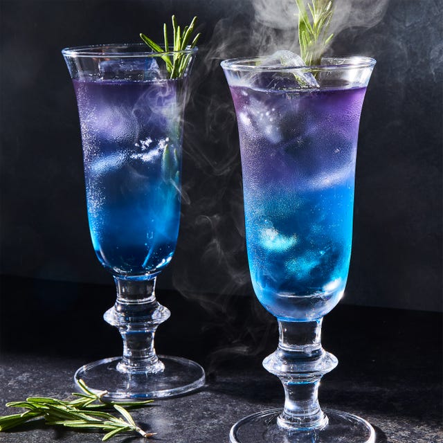 purple and blue layered drink with rosemary