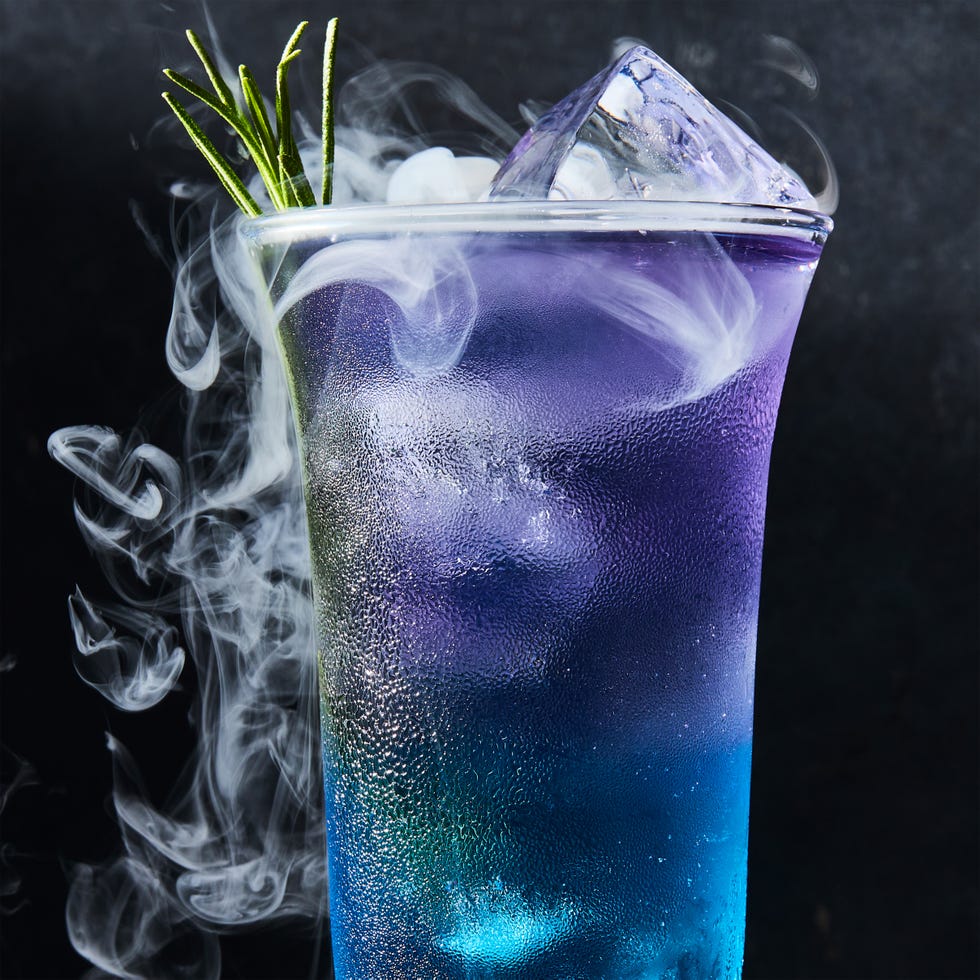 purple and blue layered drink with rosemary