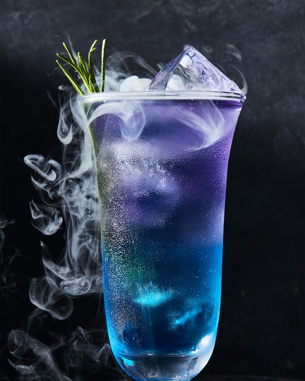 purple and blue layered drink with rosemary