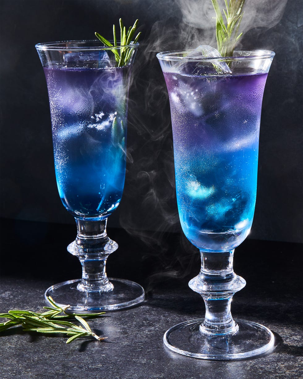 purple and blue layered drink with rosemary