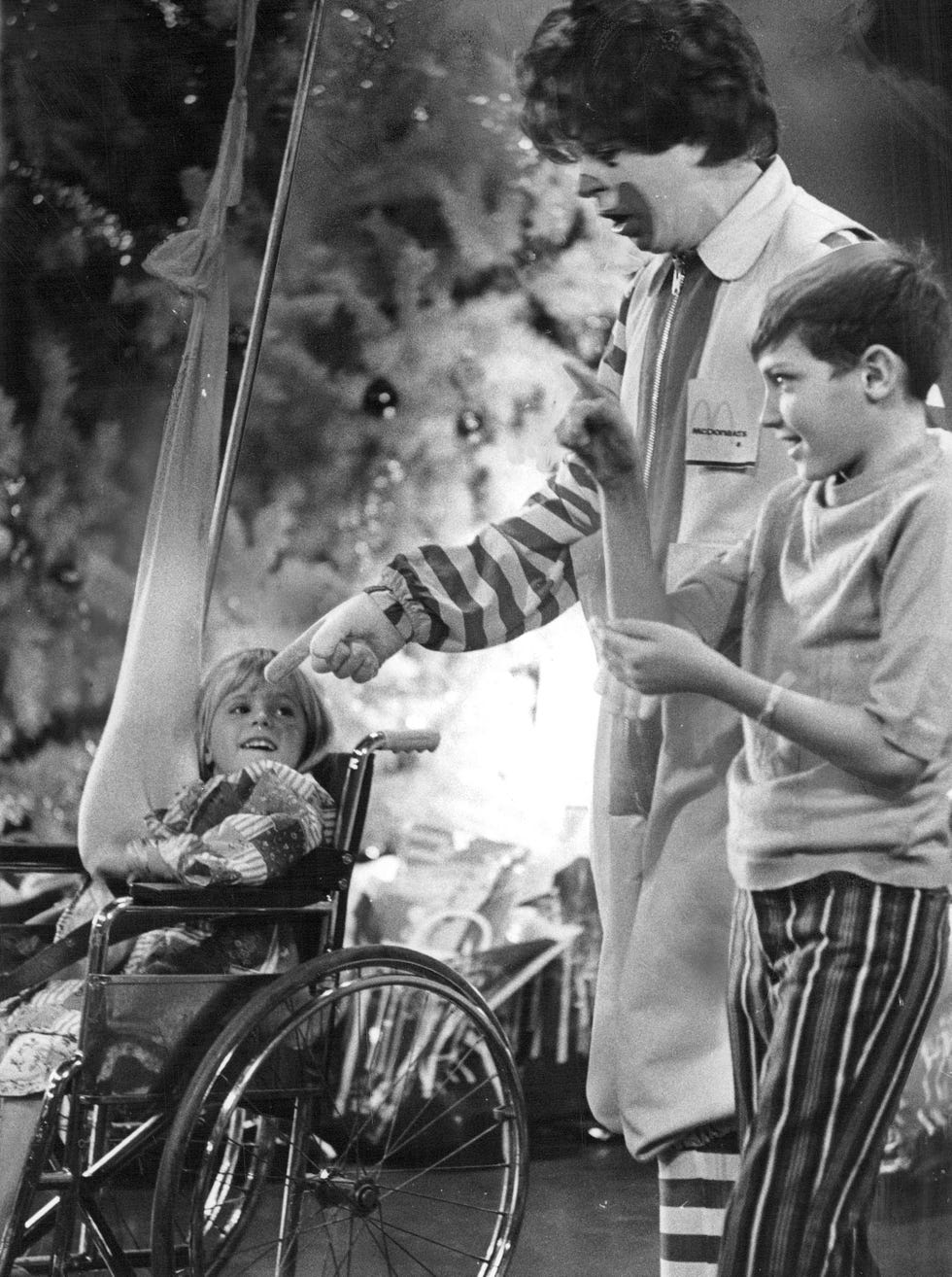 DEC 19 1971, DEC 21 1971; With clown Ronald McDonald here are Michele Campbell, 4, left, daughter of