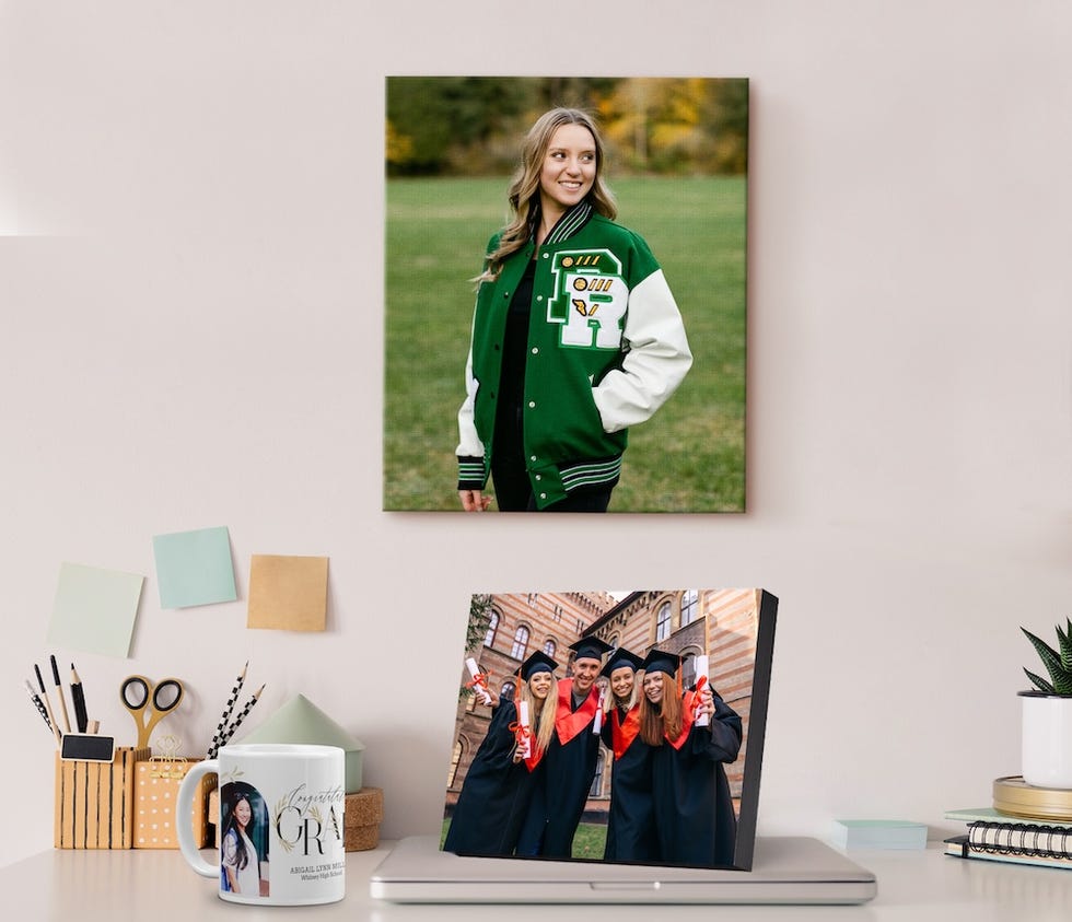 desktop display showcasing framed photographs and a personalized mug