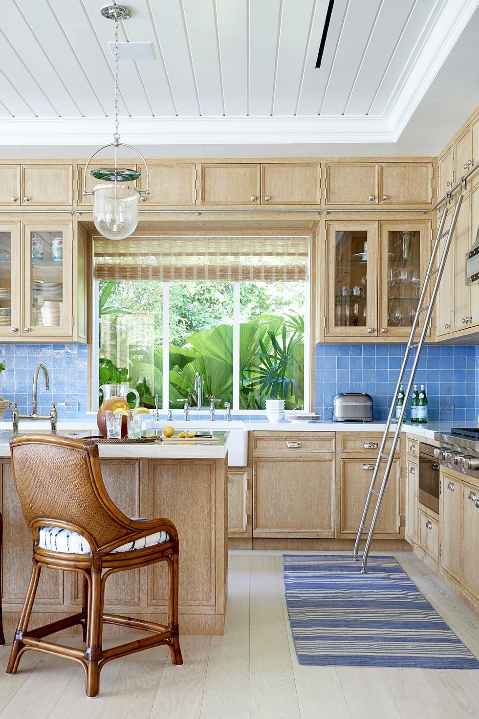 beachy kitchen design with blue tile backsplash