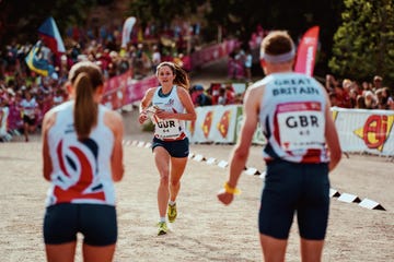 a group of people running on a track