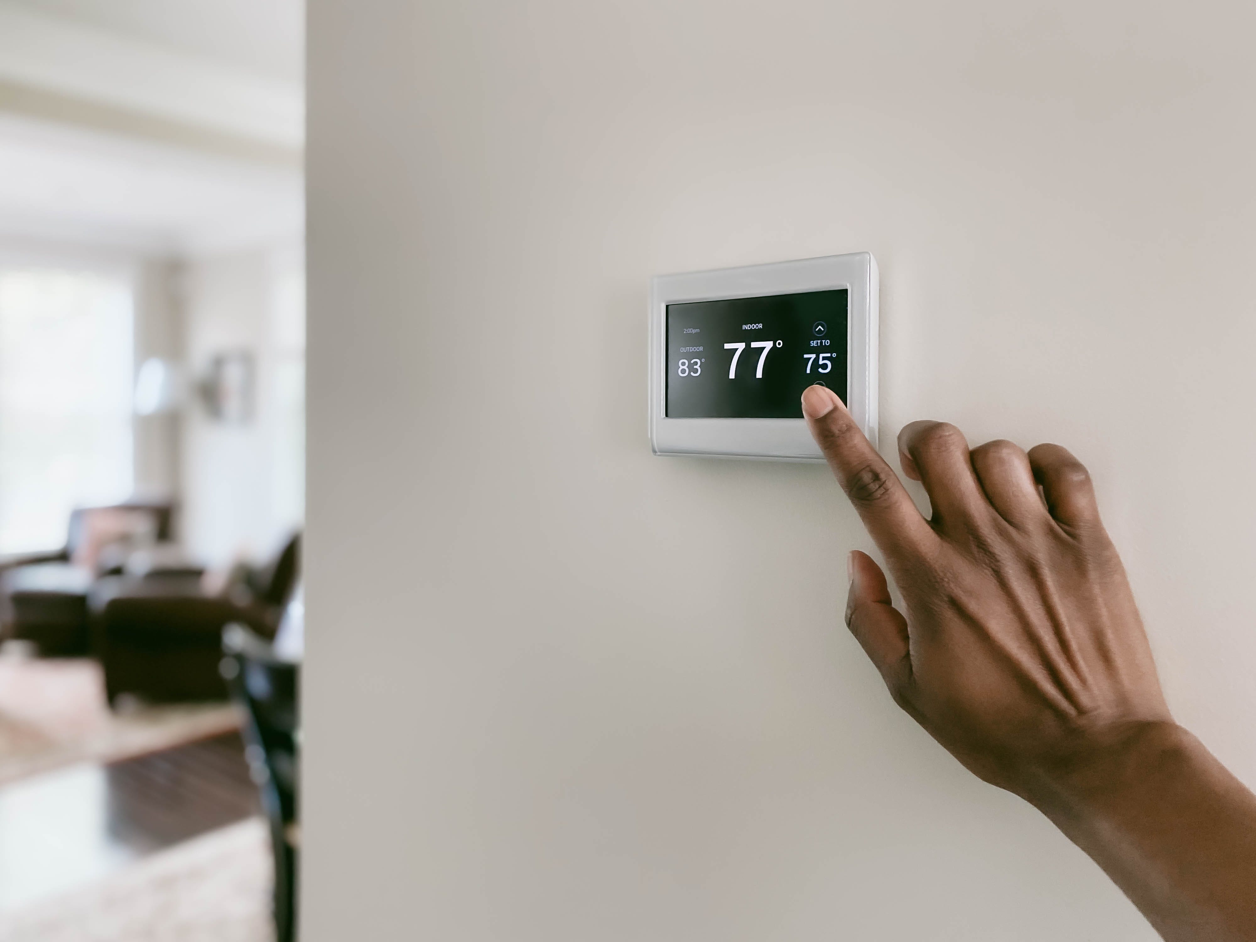 woman-adjusts-thermostat-royalty-free-image-1630958038.jpg