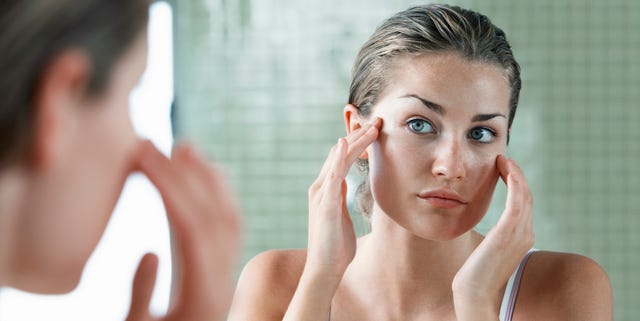 Woman Applying Facial Cream