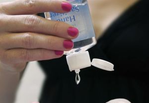 Woman Applying Hand Sanitizer