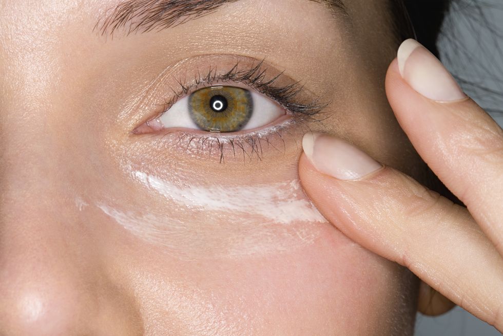woman applying moisturiser
