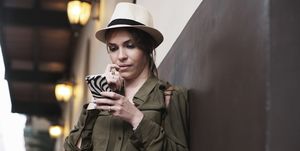 woman as tourist lost direction and looks at gps map on mobile phone