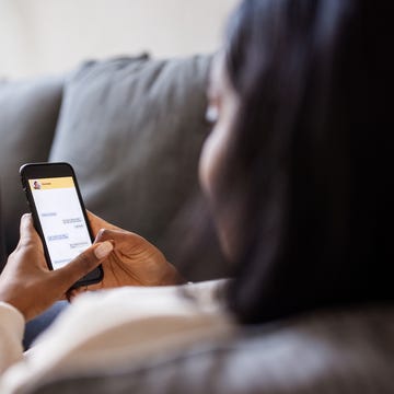 woman at home texting on her mobile phone