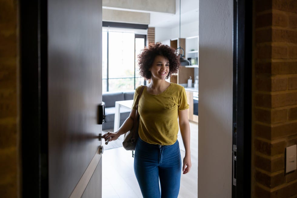 woman at the door leaving her house