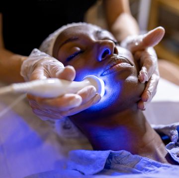 woman at the spa getting a rejuvenation treatment on her face