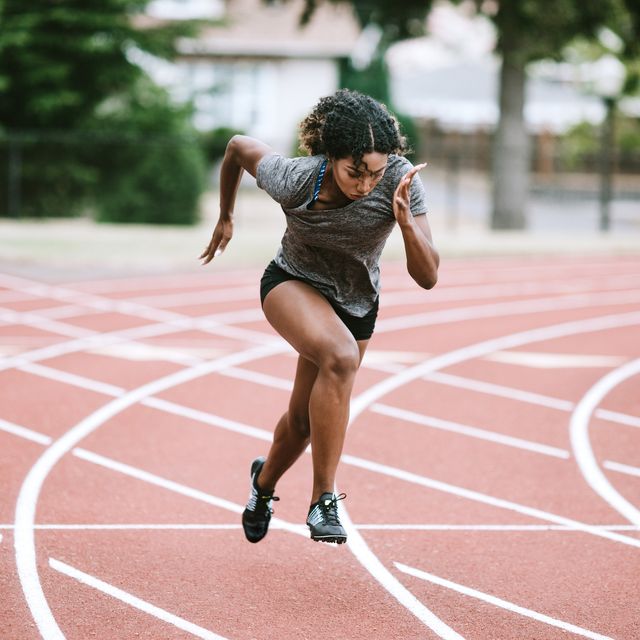 woman athlete sprints hard for track and field