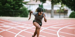 woman athlete sprints hard for track and field