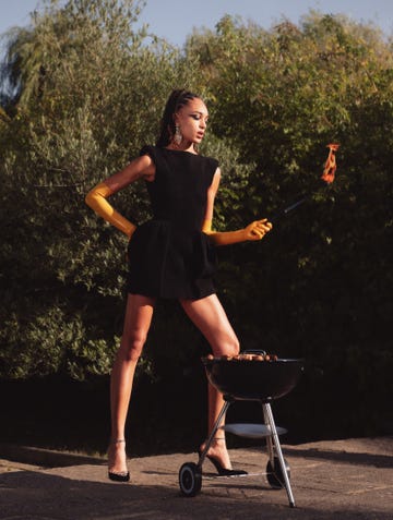 a woman bbqing