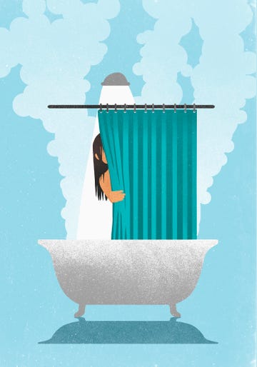 woman behind curtain in hot, steaming shower