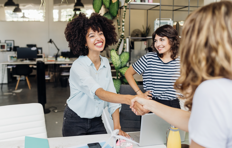 women shaking hands in a job interview