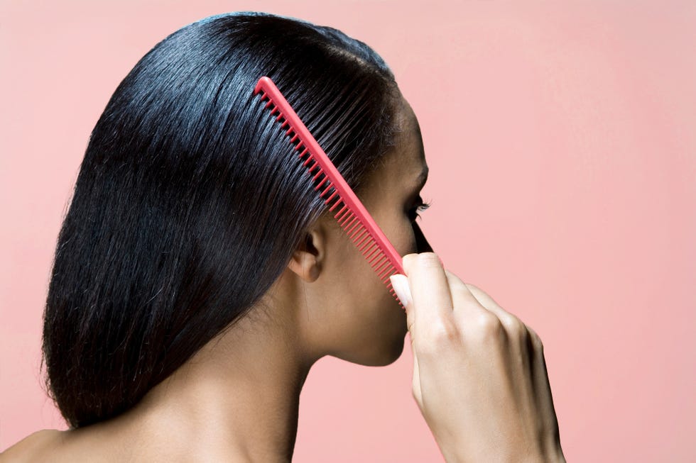 woman combing hair