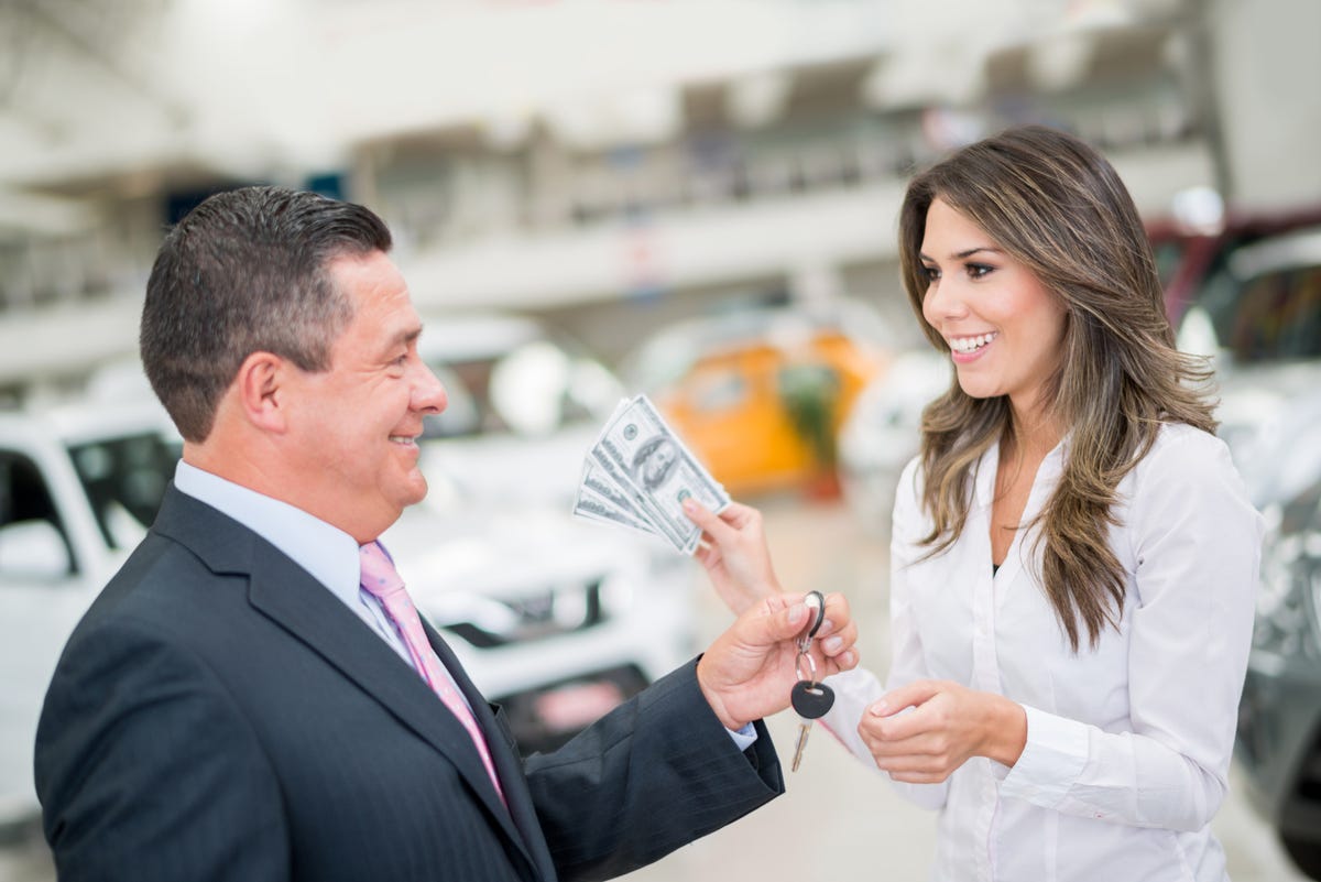 woman-buying-a-car-royalty-free-image-1585672715.jpg?resize=1200:*