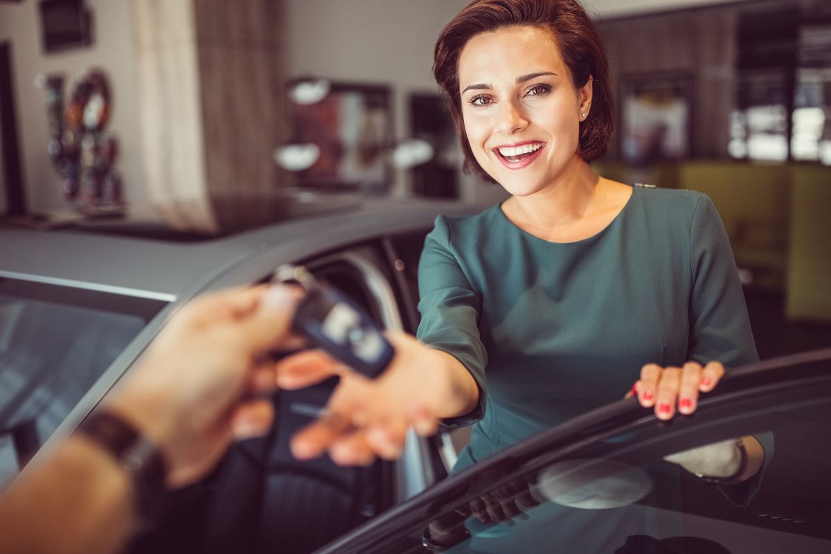 woman buying a new car