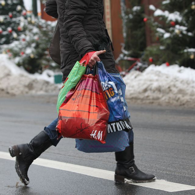 https://hips.hearstapps.com/hmg-prod/images/woman-carries-shopping-bags-two-days-before-christmas-on-news-photo-1665003270.jpg?crop=0.67033xw:1xh;center,top&resize=640:*