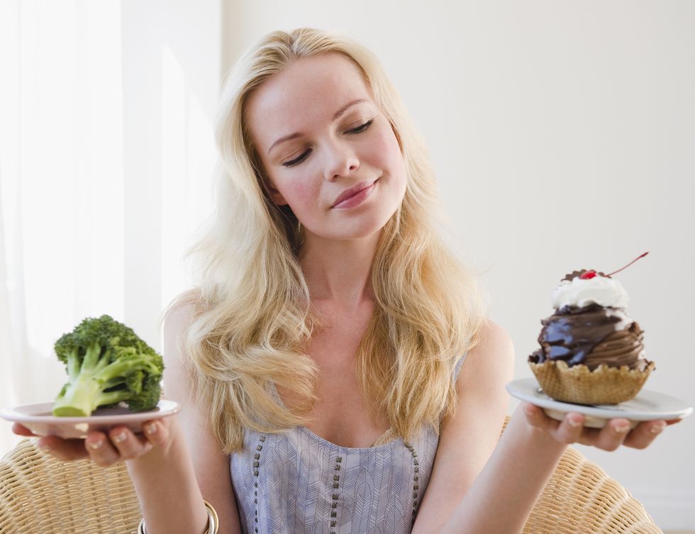 woman choosing between broccoli or sundae